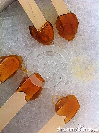 Making maple syrup taffy at the sugar shack in Quebec Stock Photo